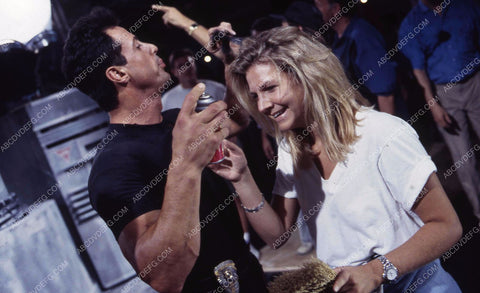 Sylvester Stallone clowning around w the hair stylist maybe on set film Demolition Man 35m-13322