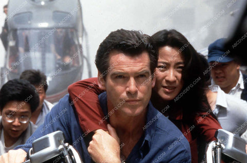 Michelle Yeoh Pierce Brosnan on the move James Bond film Tomorrow Never Dies 35m-13492