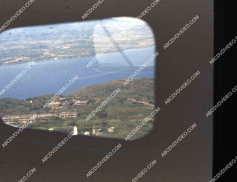 circa 1956 U.S. sailor tours historic Philippines from air in twin engine air force plane 35m-16346