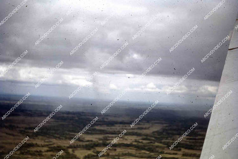 circa 1956 U.S. sailor tours historic Philippines from air in twin engine air force plane 35m-16353