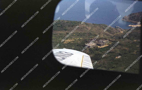 circa 1956 U.S. sailor tours historic Philippines from air in twin engine air force plane 35m-16358
