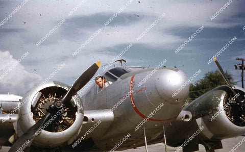 circa 1956 U.S. sailor tours historic Philippines from air in twin engine air force plane 35m-16403