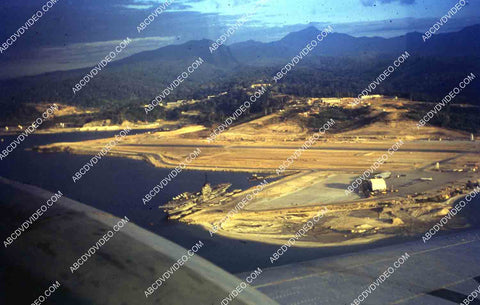 circa 1956 U.S. sailor tours historic Philippines from air USS Shangri-La in Subic Bay 35m-16404