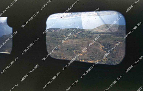 circa 1956 U.S. sailor tours historic Philippines from air in twin engine air force plane 35m-16412
