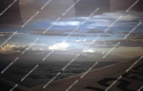 circa 1956 U.S. sailor tours historic Philippines from air in twin engine air force plane 35m-16413