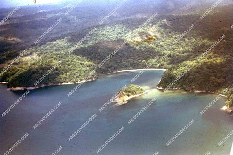 circa 1956 U.S. sailor tours historic Philippines from air in twin engine air force plane 35m-16416