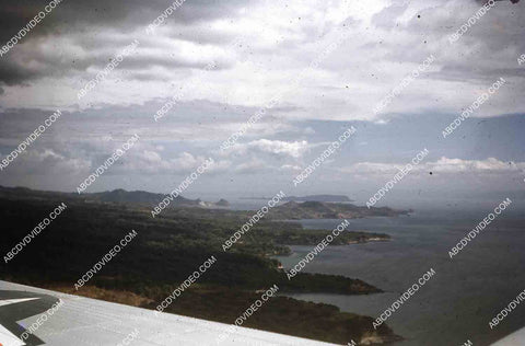 circa 1956 U.S. sailor tours historic Philippines from air in twin engine air force plane 35m-16419