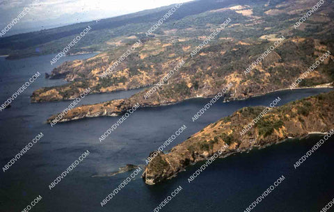 circa 1956 U.S. sailor tours historic Philippines from air in twin engine air force plane 35m-16420