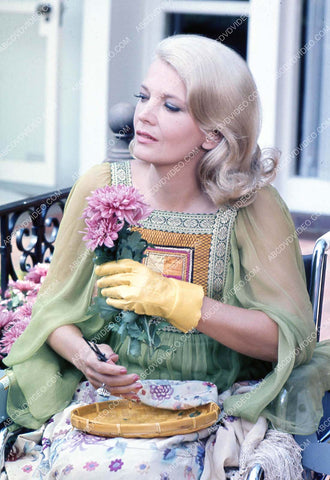 Gena Rowlands trimming some flowers 35m-17169