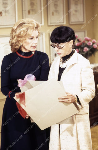 Edith Head with material samples and sketches 35m-5110