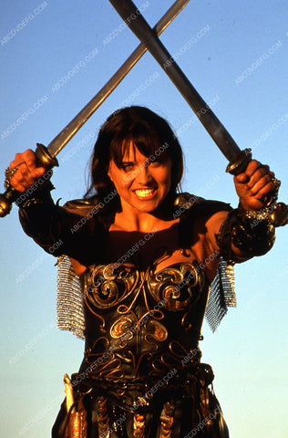sexy action babe Lucy Lawless sword in each hand TV Xena Warrior Princess 35m-6717
