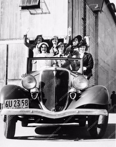 MGM girls in a new automobile on the MGM backlot 3629-33