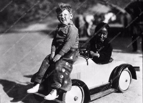 Harry Carey Jr and Navaho Indian kid in mini car 3843-26