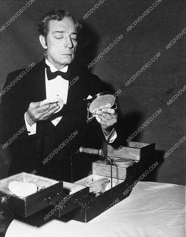 Buster Keaton w his makeup box does a quick touch up 3899-10