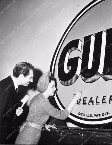 candid Hollywood Deanna Durbin signing Gulf Oil dealer sign 4345-29