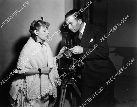 cinematographer John J Mescall goes over lenses w Irene Dunne on set film Show Boat 4588-10