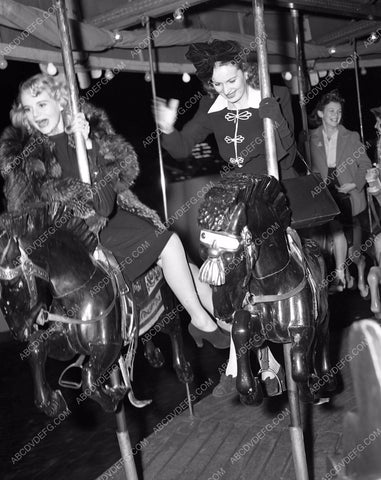 Marie Wilson Maureen O'Hara enjoy merry-go-round carousel ride 45bx02-01