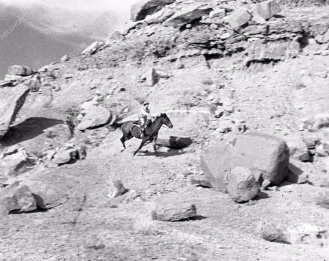 cowboy galloping through desert 45bx06-346
