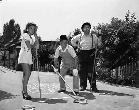 candid Stan Laurel Oliver Hardy tend garden at home in backyard 45bx08-293