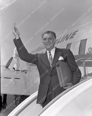 Wesley Ruggles boarding an airplane 4b10-279