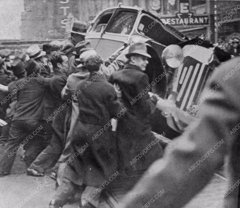 news photo strikers overturn automobile 4b10-585