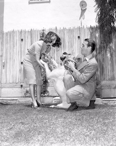 Douglas Fairbanks Jr. Mary Lee playing with the dog 4b10-601