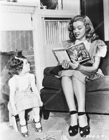 Marilyn Monroe reads a storybook to a child 5073-29