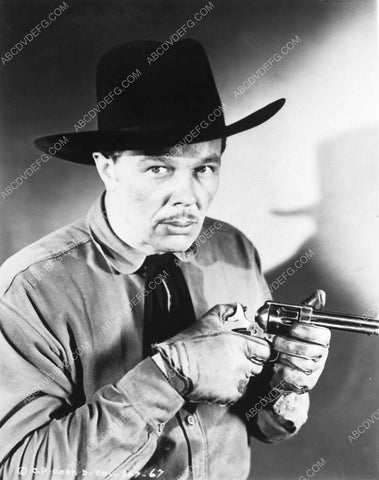 Dick Curtis checking his six shooter 5109-20