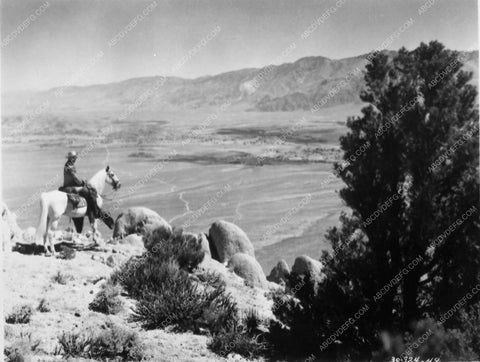 Smith Ballew looks out over the valley below film Western Gold 5190-04