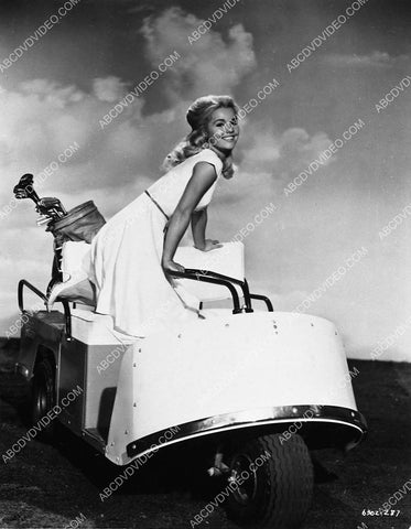beautiful Tuesday Weld sitting on the golf cart 5583-02