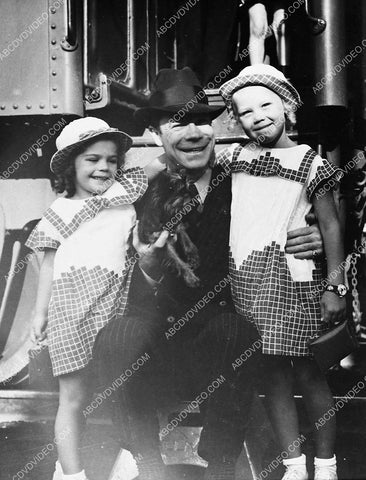 Joe E Brown at train station w daughters Mary Elizabeth and Kathryn Frances and their dog 5585-23