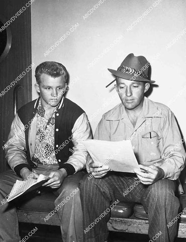 great candid Gary Crosby and dad Bing Crosby going over some script 5596-031