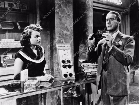 Clifton Webb buying some sun glasses film Dreamboat 5597-32