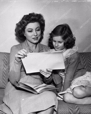 candid Greer Garson in her dressing room making a scrapbook maybe 5598-12