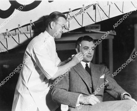 Jack Pierce does makeup for Robert Taylor 5623a-04
