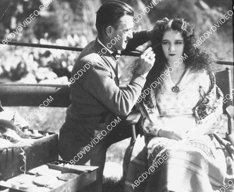Jack Pierce does makeup for Mary Philbin for outdoor film shoot unknown film 5623a-17
