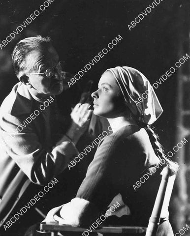 Jack Pierce does finishing makeup for Ingrid Bergman 5623a-20