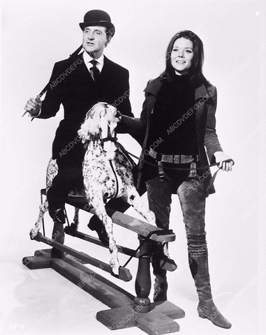 Patrick Macnee on a rocking horse Diana Rigg TV The Avengers 5760-02