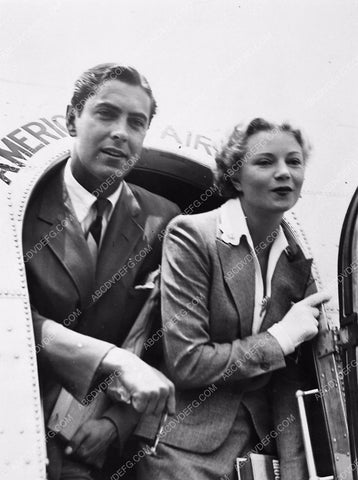 candid Tyrone Power and wife Annabella getting off an airplane 5765a-32