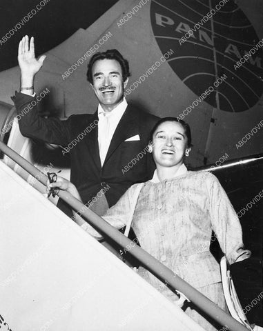Gilbert Roland and his wife getting on Pan Am airplane 6244-17