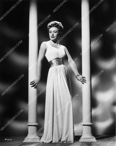 Priscilla Lane standing among the columns 6244-32