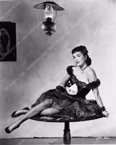 beautiful Julie Adams in fishnets sitting on the poker table 6269-29