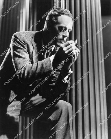 Leslie Howard lighting up a cigarette 6573-13