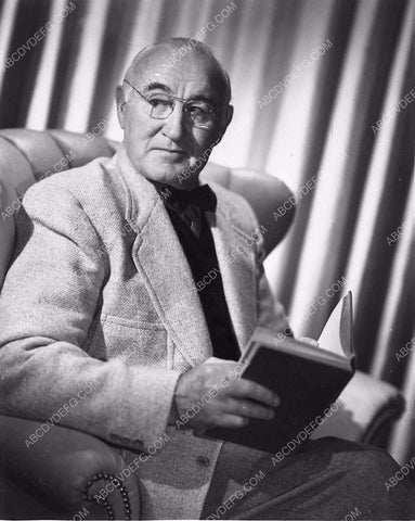 Donald Crisp sits down to read a book 6619-07
