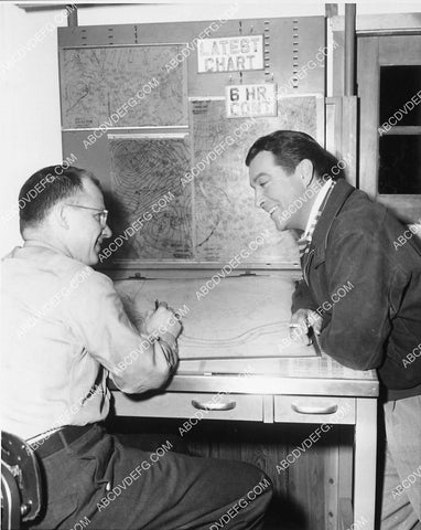 Robert Taylor looking over some weather charts before his flight 6628-23
