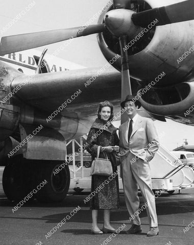 Robert Taylor and wife maybe at the airport on the tarmac 6628-26