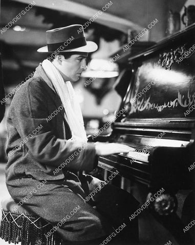 Robert Taylor sitting at the piano 6628-33