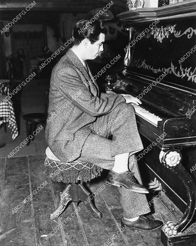 Robert Taylor sitting at the piano 6628-34