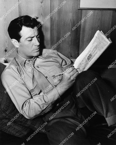 Robert Taylor enjoying a crossword puzzle 6629-23