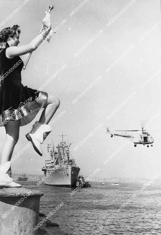 cheerleader girl greets naval ships and helicopters to Los Angeles harbor 6851-023